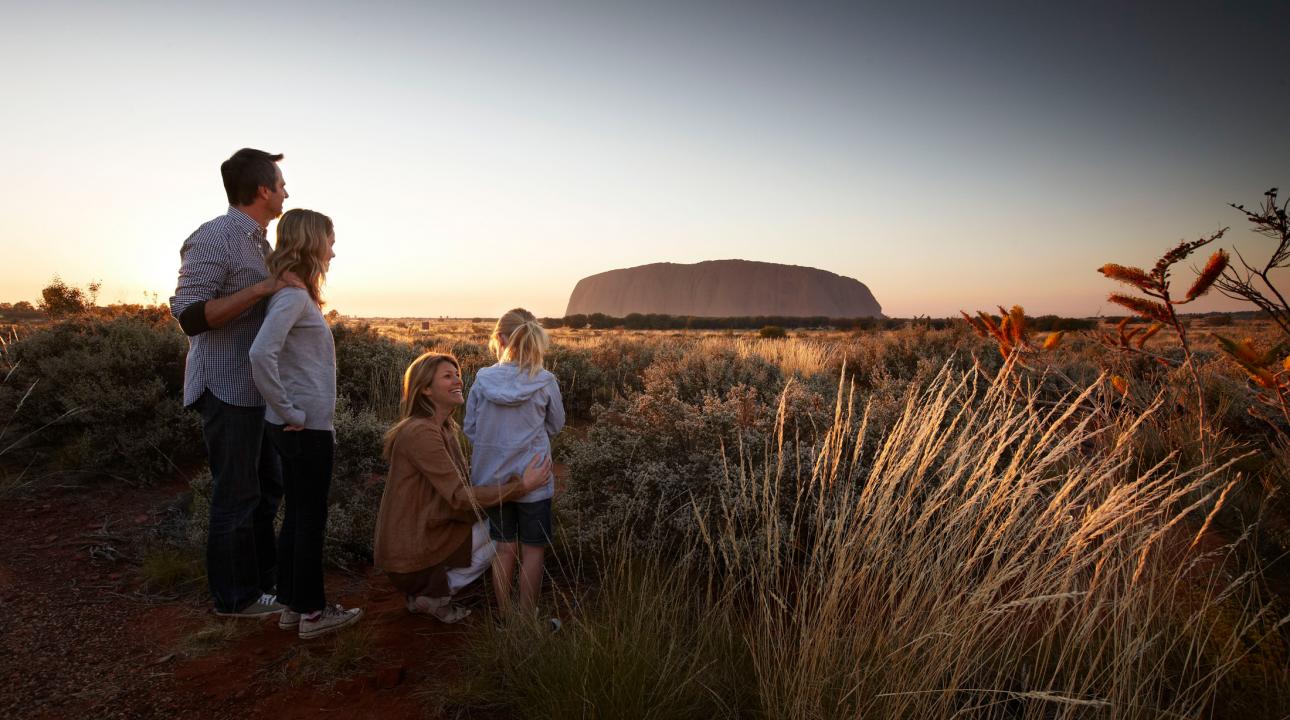 A family looking at Ayer's Rock at sunset | Uluru Australia | Uluru Rockies | Mossmangor Indigenous Tourism