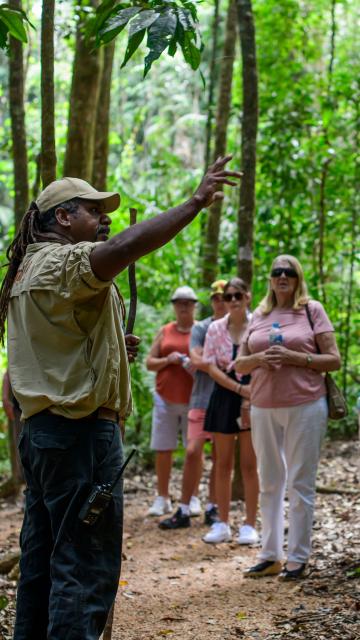Guide showing tourist around Mossman Gorge 