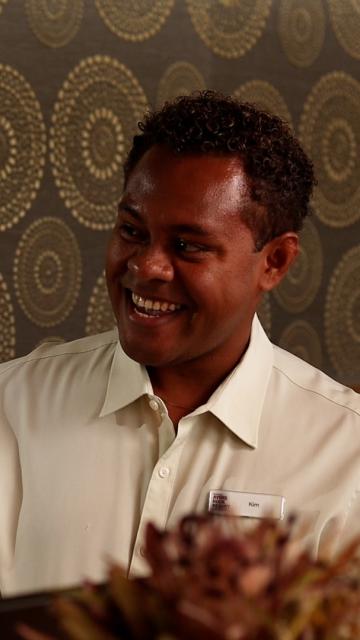 Two people having a conversation and smiling 